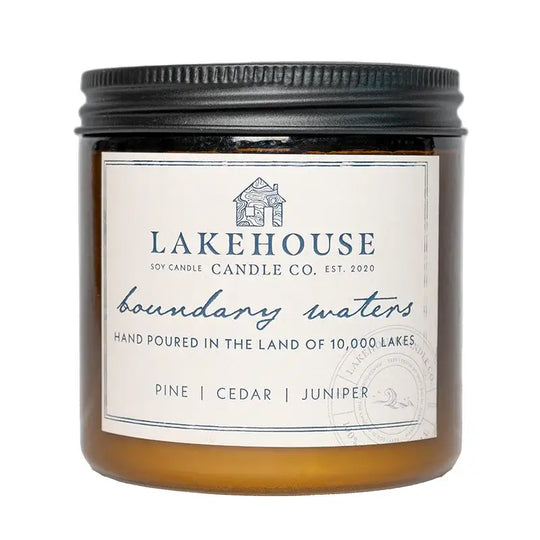 Lakehouse Candle Company Soy Candle in boundary waters with pine, cedar, juniper with a white background
