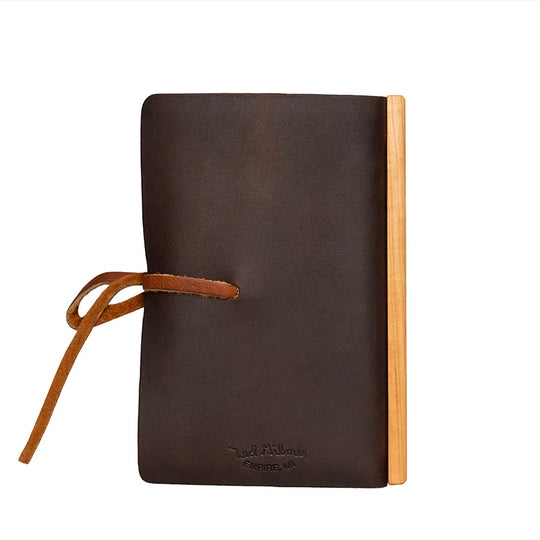 Duluth Pack Leather Tie Journal in brown showing the back with a white background