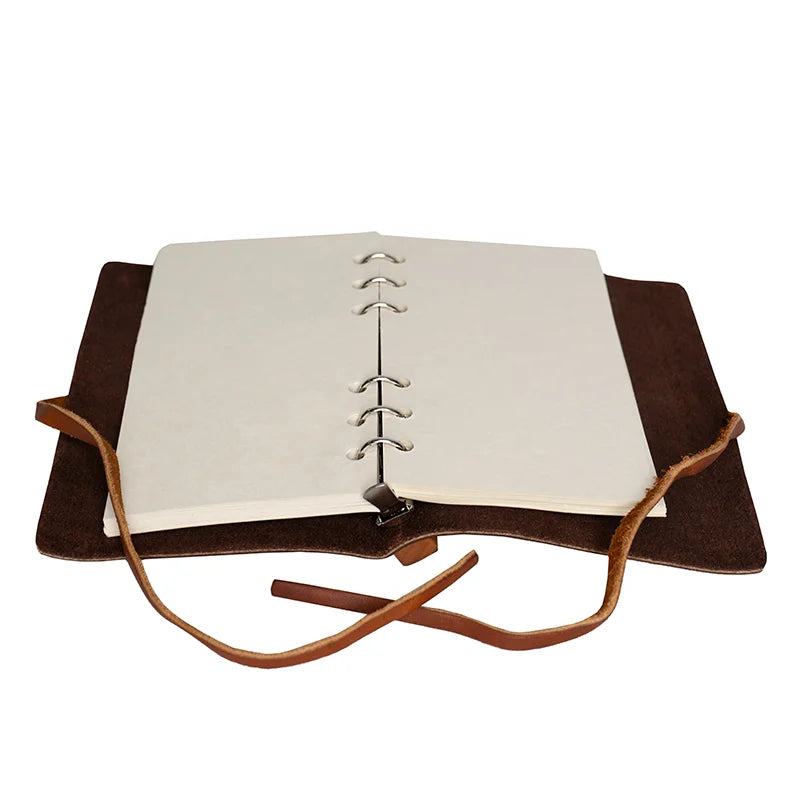 Duluth Pack Leather Tie Journal in brown the journal open with a white background