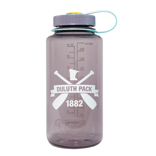 Light purple Nalgene Water Bottle with cross canoe paddles Duluth Pack logo on it on a white background