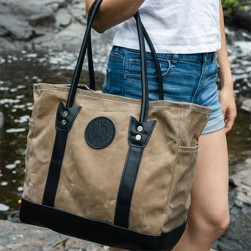 Lake Ontario Highlander Tote Black Trim and Wax Khaki Held by Woman