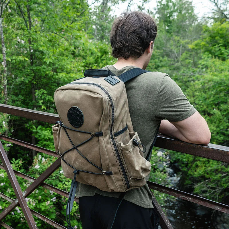 Woodsmans Pack Backpack Lake Ontario Black Trim and Wax Khaki on Back of Man
