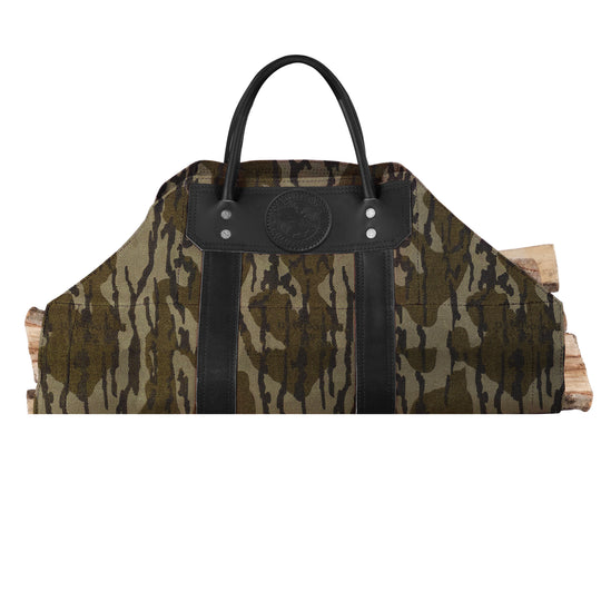Log Carrier with riveted leather reinforcements in camouflage canvas, designed for carrying firewood at home, cabin, or camping settings.
