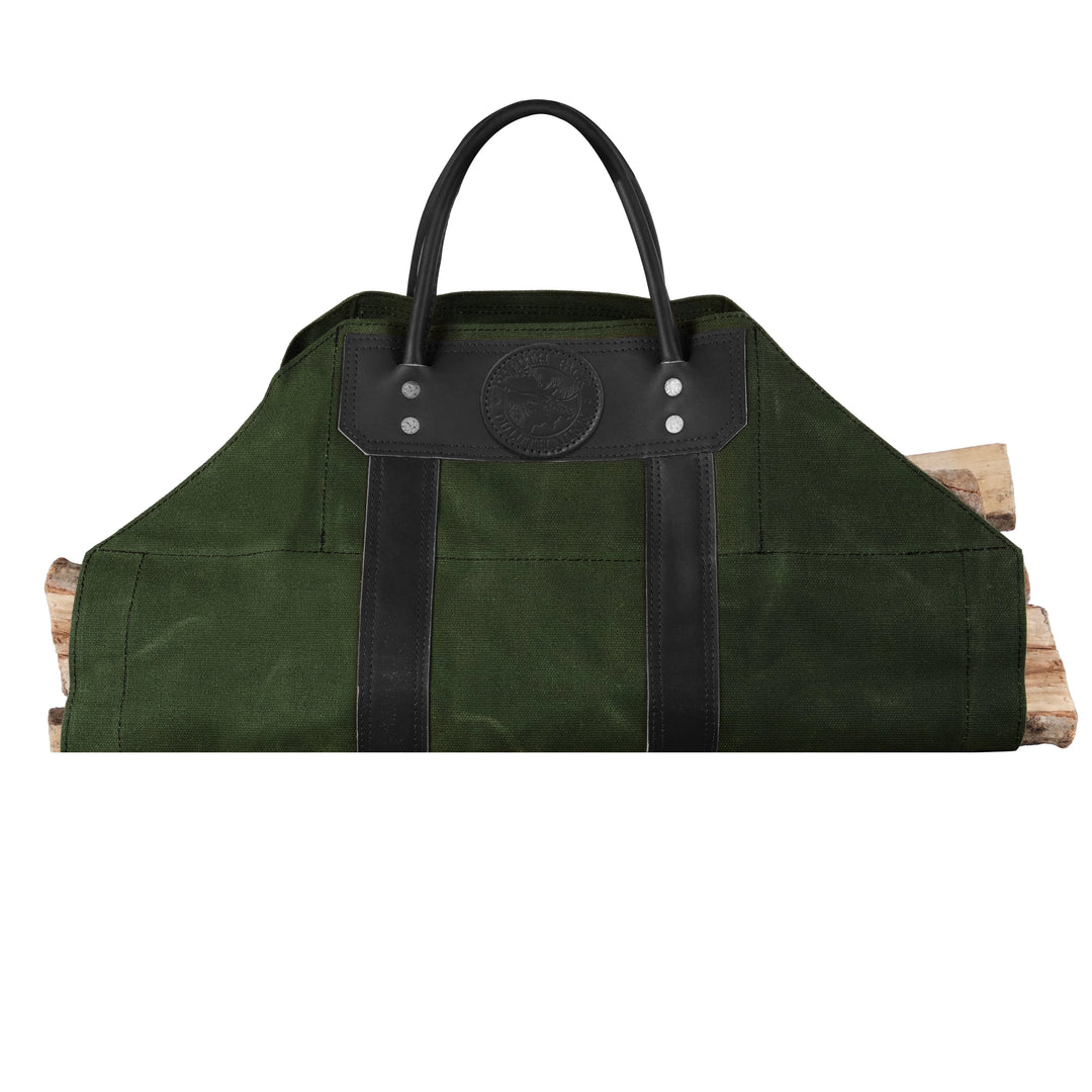 Log Carrier in waxed canvas with riveted leather handles designed for carrying firewood easily at home, the cabin, or camping outdoors