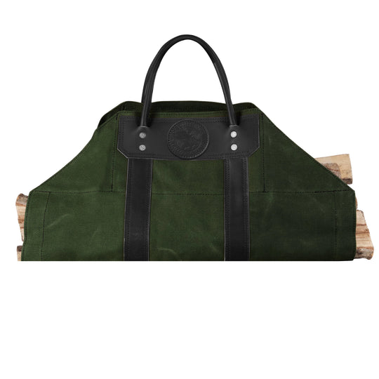 Log Carrier in waxed canvas with riveted leather handles designed for carrying firewood easily at home, the cabin, or camping outdoors