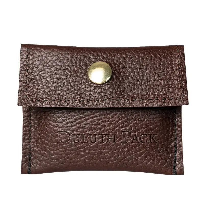 Duluth Pack Leather Hold-All Snap Wallet in Black Pebbled Leather with white background. 