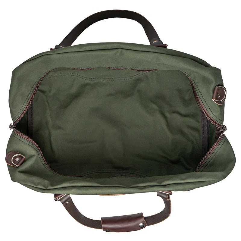Weekender Duffel in Olive Drab by Duluth Pack, showcasing durable handcrafted canvas and leather interior ideal for rugged outdoor use and travel.