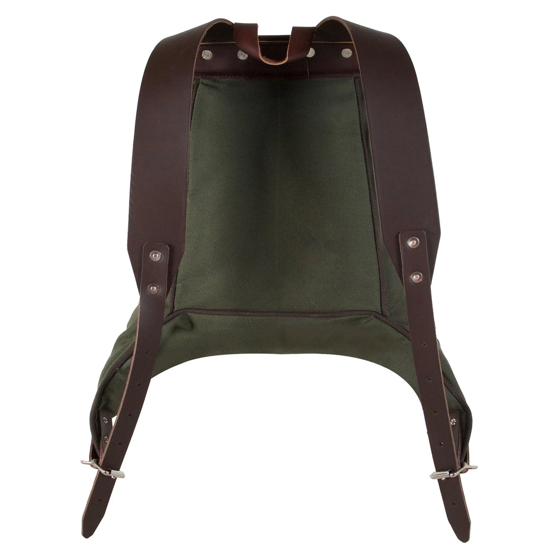 Rucksack Backpack in rugged waxed canvas with dark brown leather shoulder straps, designed by Duluth Pack for durable outdoor and everyday use.