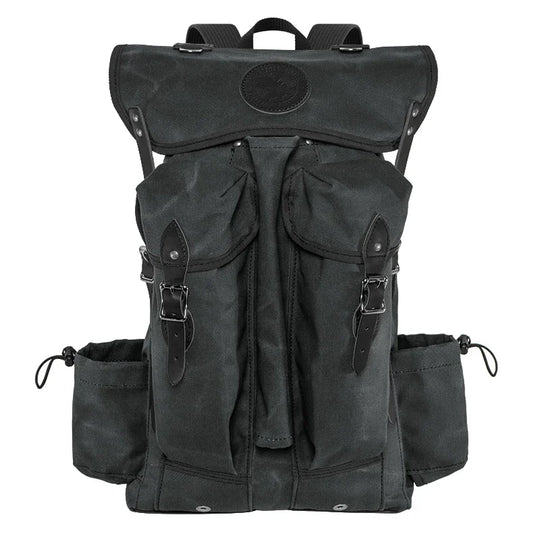Outlander Pack in dark waxed canvas with leather accents, a handcrafted lightweight backpack designed for bushcraft and rugged outdoor use by Duluth Pack.