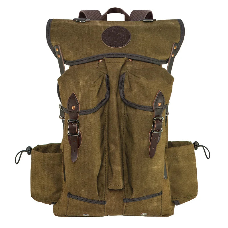 Outlander Pack in waxed canvas and leather with low profile design, perfect for rugged outdoor use and tight trails by Duluth Pack.