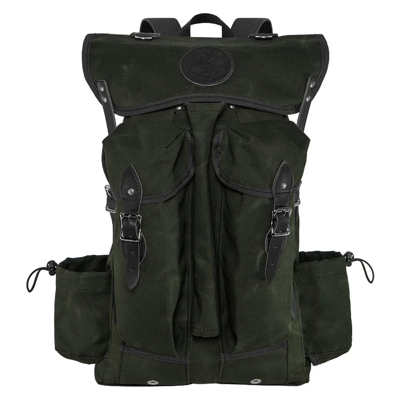 Outlander Pack in dark waxed canvas with leather accents, featuring a low profile design ideal for rugged outdoor bushcraft and dense trail use.