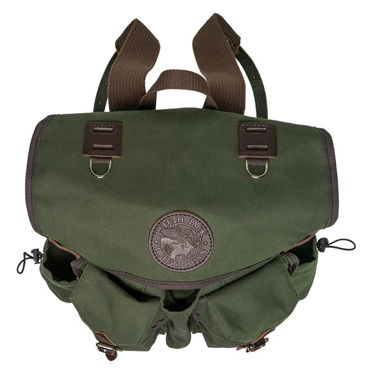Outlander Pack in rugged green canvas with leather accents, designed for durable bushcraft use on narrow, challenging trails by Duluth Pack.