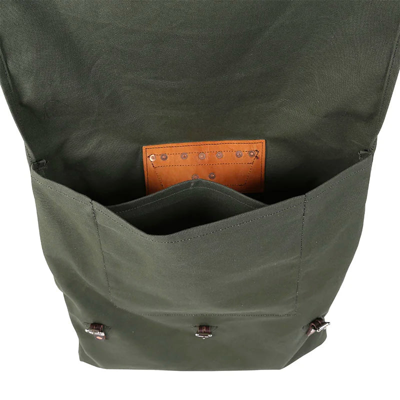 #2 Original Canoe Pack - 59 L in rugged green canvas with leather patch detail, showcasing the durable interior pocket designed for outdoor adventures by Duluth Pack.
