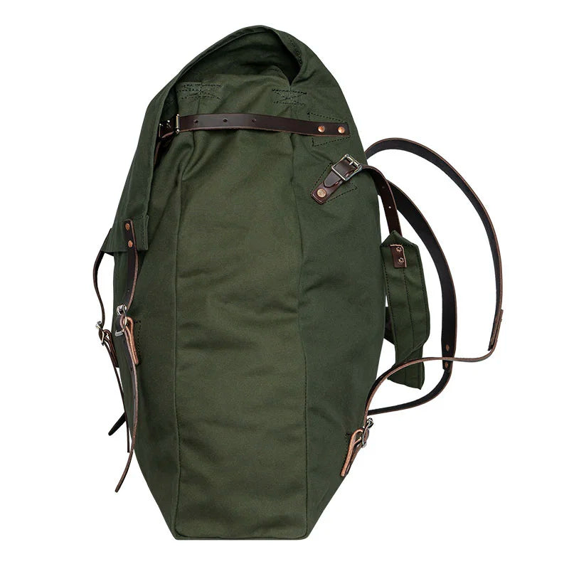 #4 Original Pack - 95 L made of tough green canvas with reinforced leather straps, designed for rugged outdoor use by Duluth Pack.
