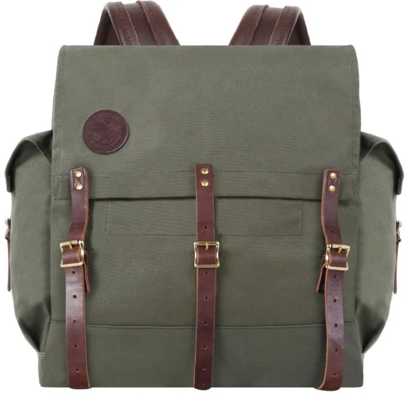 #3 Monarch Pack - 54 L in durable olive canvas with rich brown leather straps, showcasing handcrafted rugged outdoor design by Duluth Pack for adventure use.