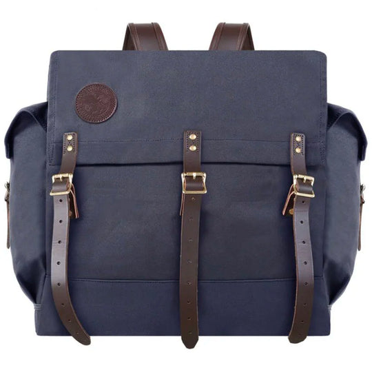 #4 Monarch Pack in navy canvas with leather straps, featuring durable craftsmanship by Duluth Pack, designed for rugged outdoor use and traditional style.
