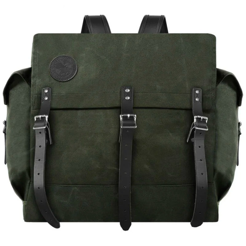 #4 Monarch Pack in olive green burly canvas with black leather straps, designed for rugged outdoor use by Duluth Pack.