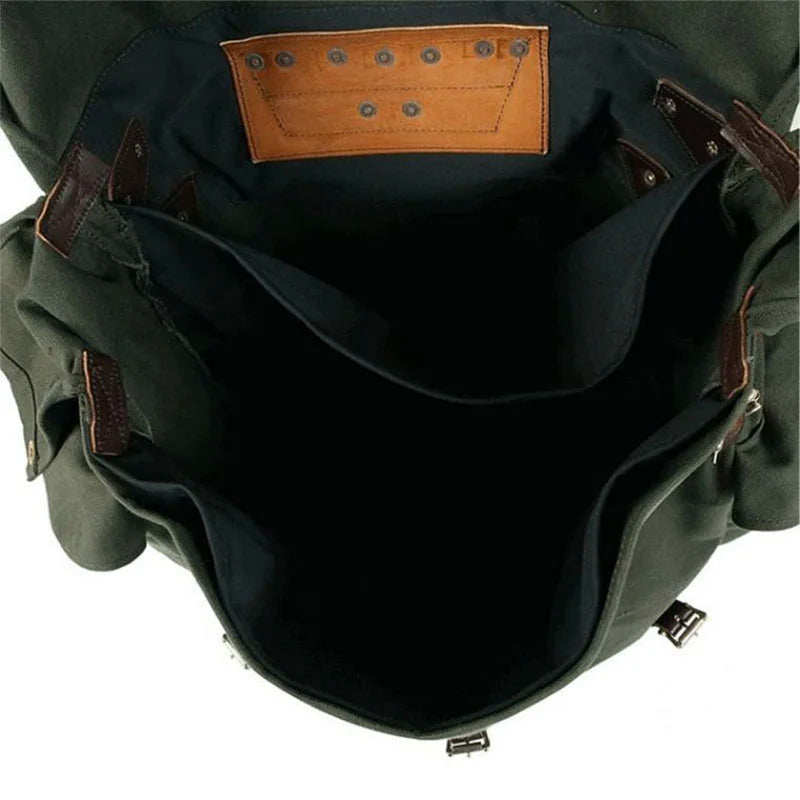 #4 Monarch Pack with burly 15-ounce canvas and leather accents, open to show spacious interior designed for durable outdoor and canoe pack use by Duluth Pack.