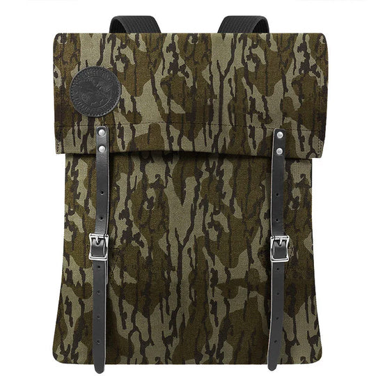 #51 Utility Pack in tough camouflage canvas with premium leather straps, designed by Duluth Pack for durable outdoor use and classic craftsmanship heritage.
