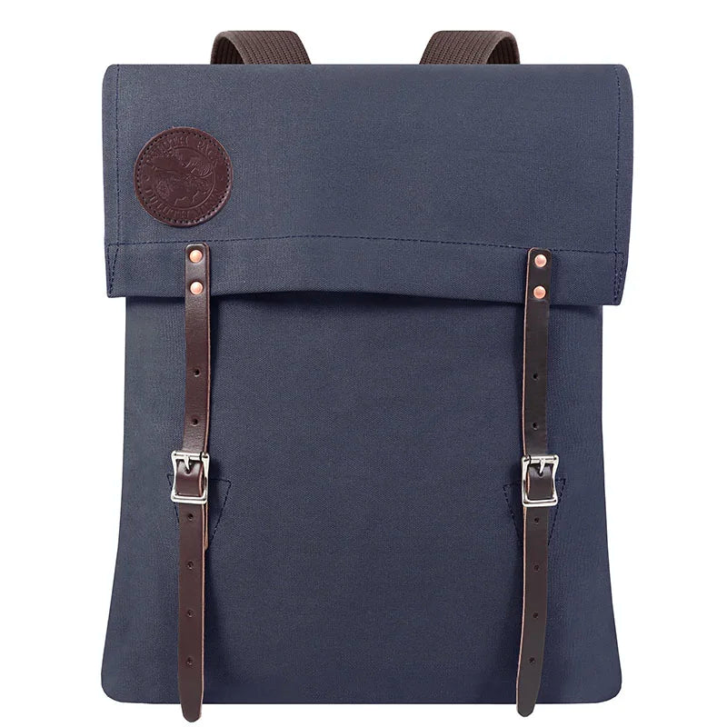 #51 Utility Pack in tough navy canvas with premium leather straps, designed by Duluth Pack for durable, rugged outdoor use and lasting performance.