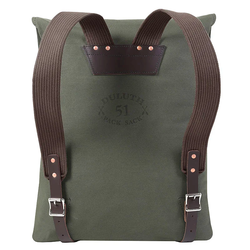 #51 Utility Pack in tough olive green canvas with brown leather accents and straps, designed by Duluth Pack for durable outdoor use and rugged performance.