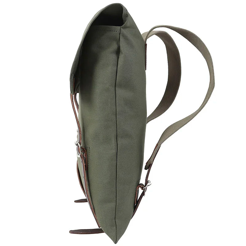 #51 Utility Pack in tough green canvas with premium leather accents, designed for durable outdoor use by Duluth Pack.