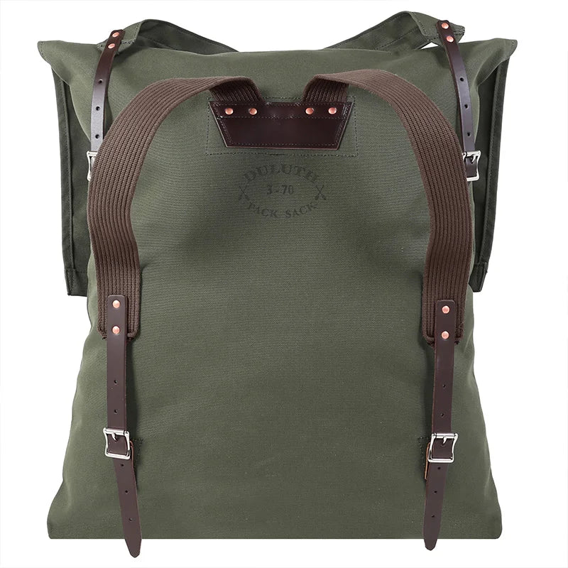 #3-70 Utility Pack - 60 L in rugged green canvas with leather straps and reinforced cotton shoulder straps, designed for durable outdoor use and hiking.