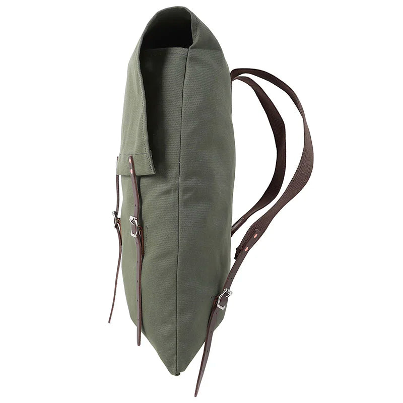 #3-70 Utility Pack - 60 L in durable green canvas with reinforced leather straps, designed for rugged outdoor use by Duluth Pack.