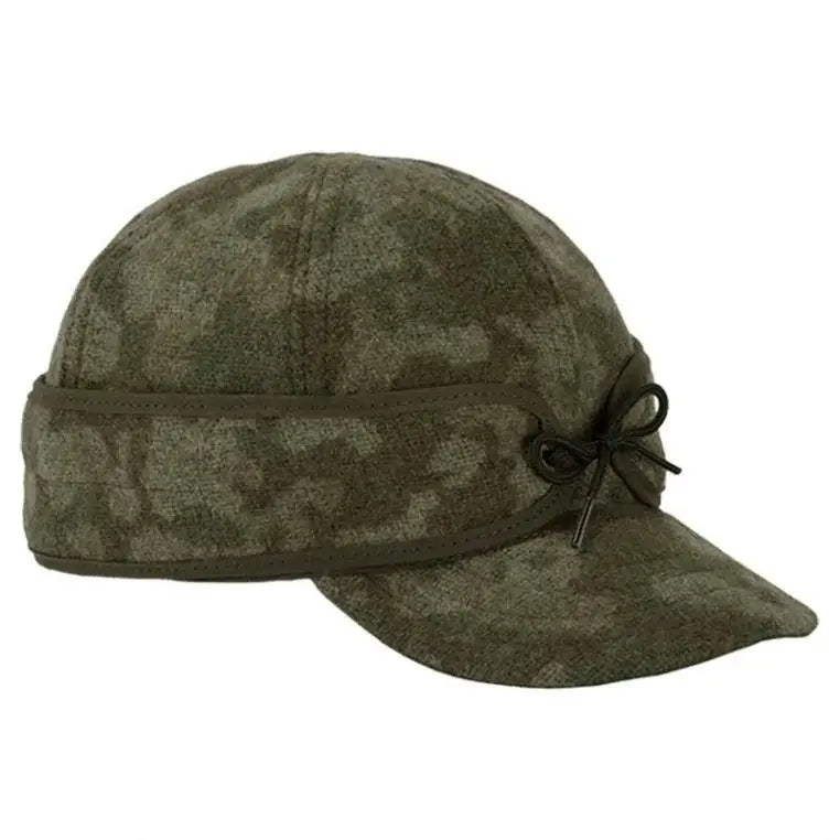 The Original Stormy Kromer Cap in Dark Green Ottawa Camouflage on a White Background