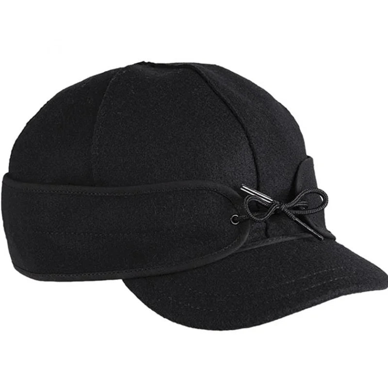 Stormy Kromer The Millie Kromer Cap in black with a white background