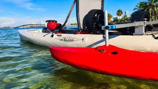 Spring Creek HD Kayak Stabilizer Floats Complete Package in red Mounted on a Kayak In The Water