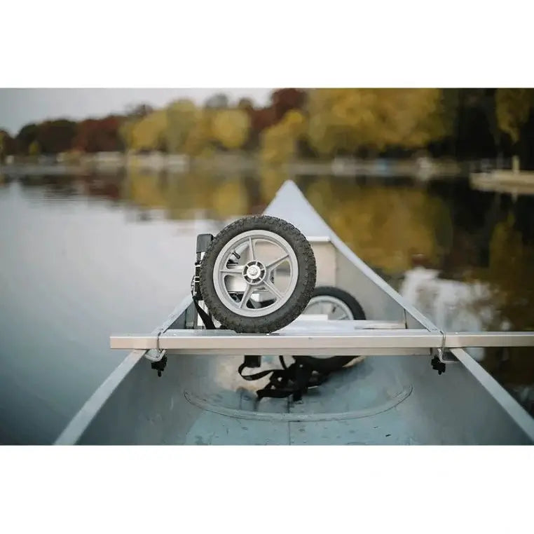 Spring Creek Canoe/Kayak Portage Cart Folded in the Bow Of A Canoe in the middle of a lake