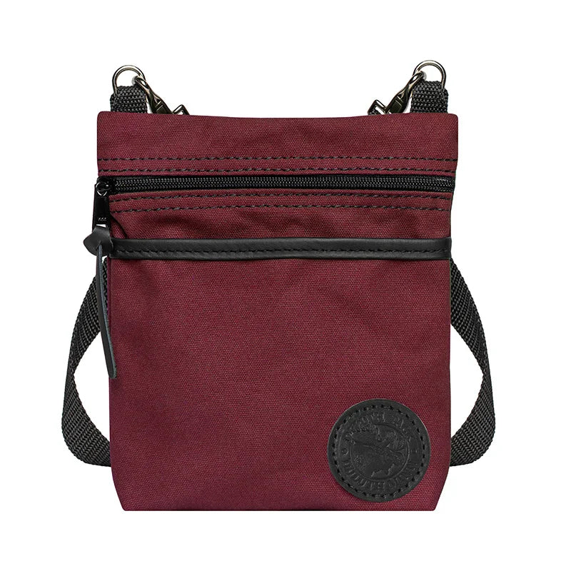 Signature Crossbody Purse in burgundy rugged canvas with adjustable black cotton webbing strap, designed for durable outdoor use by Duluth Pack.