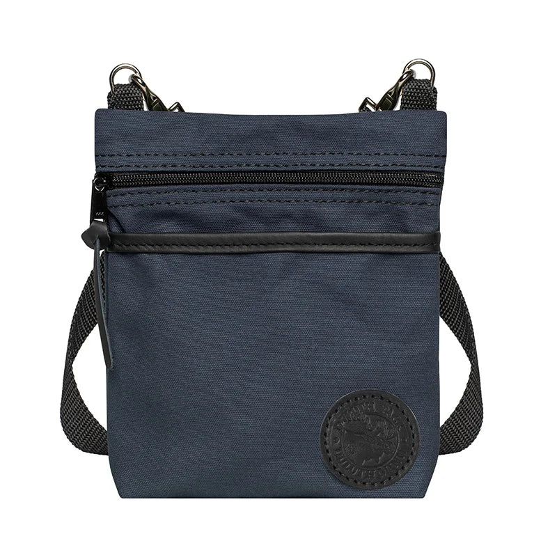 Signature Crossbody Purse in navy rugged 15-ounce canvas with adjustable strap, designed by Duluth Pack for durable everyday outdoor use.