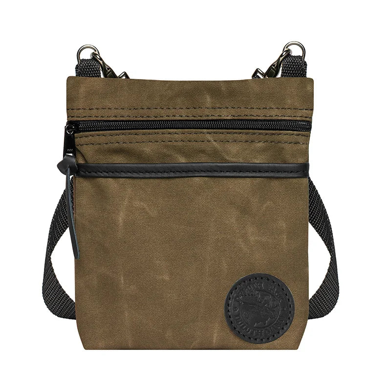 Signature Crossbody Purse in waxed khaki with rugged canvas and adjustable strap, designed by Duluth Pack for durable outdoor use and timeless craftsmanship.