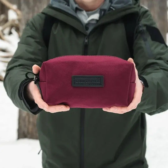 The NEW Limited Edition Lake Huron Grab-N-Go Being Held By A Person Over Snow