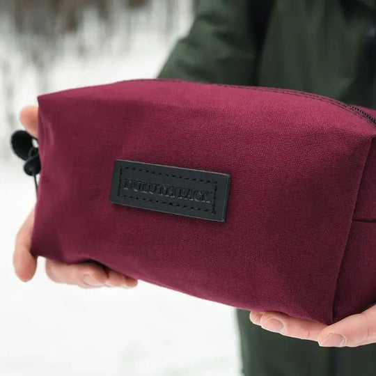 The NEW Limited Edition Lake Huron Grab-N-Go Being Held By A Person Over Snow From The Side