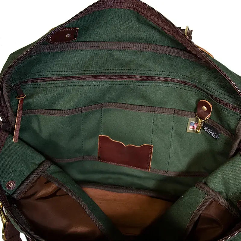 The Entrepreneur Briefcase In Olive Drab Green Showing Internal Zipper Pockets, Slip Pockets, Key Clip, &amp; Tags On A White Background