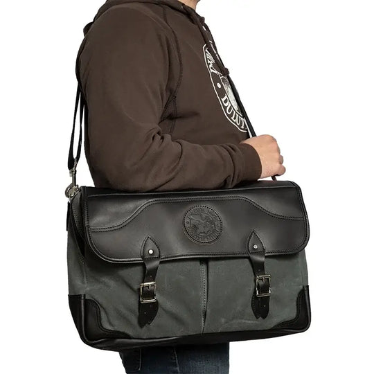 The Entrepreneur Briefcase In Waxed Grey Over The Shoulder Of A Man On A White Background