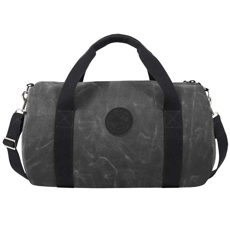 Round Duffel In Waxed Grey On A White Background