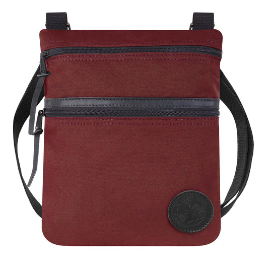 Traverse Crossbody Bag in burgundy with black accents by Duluth Pack, featuring durable canvas and leather, designed for everyday rugged outdoor use and style.