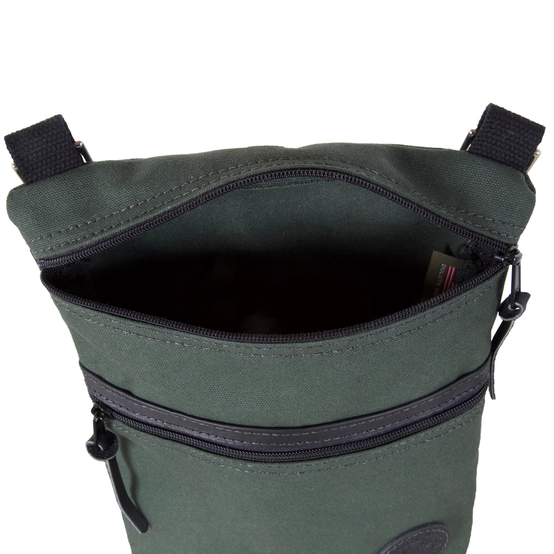 Traverse Crossbody Bag in Olive Drab featuring durable canvas construction and zippered compartments, designed by Duluth Pack for rugged outdoor use.