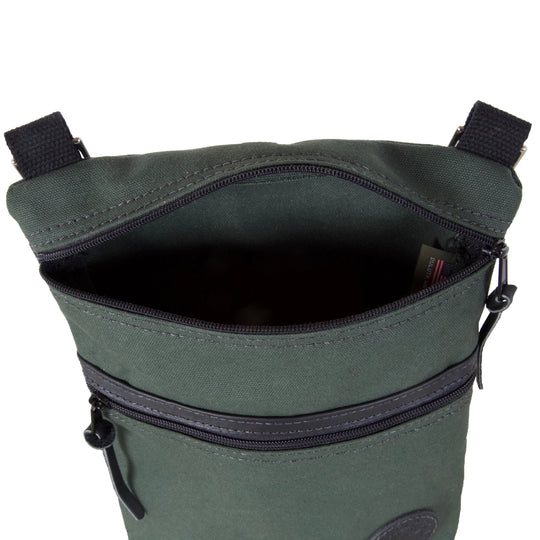 Traverse Crossbody Bag in Olive Drab featuring durable canvas construction and zippered compartments, designed by Duluth Pack for rugged outdoor use.