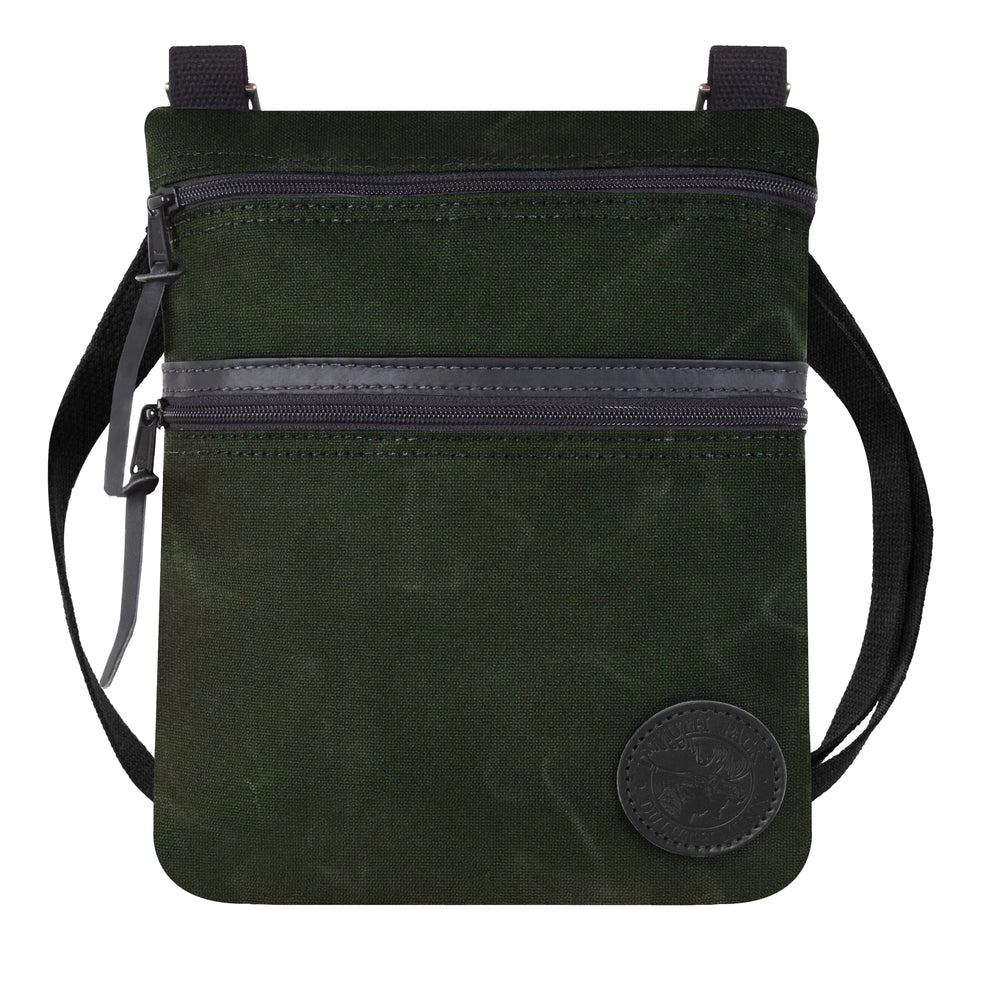 Traverse Crossbody Bag in olive drab waxed canvas with durable construction and adjustable strap, crafted by Duluth Pack for rugged outdoor use.