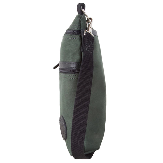 Traverse Crossbody Bag in olive drab canvas with black adjustable strap, designed by Duluth Pack for durable outdoor use and everyday carry.