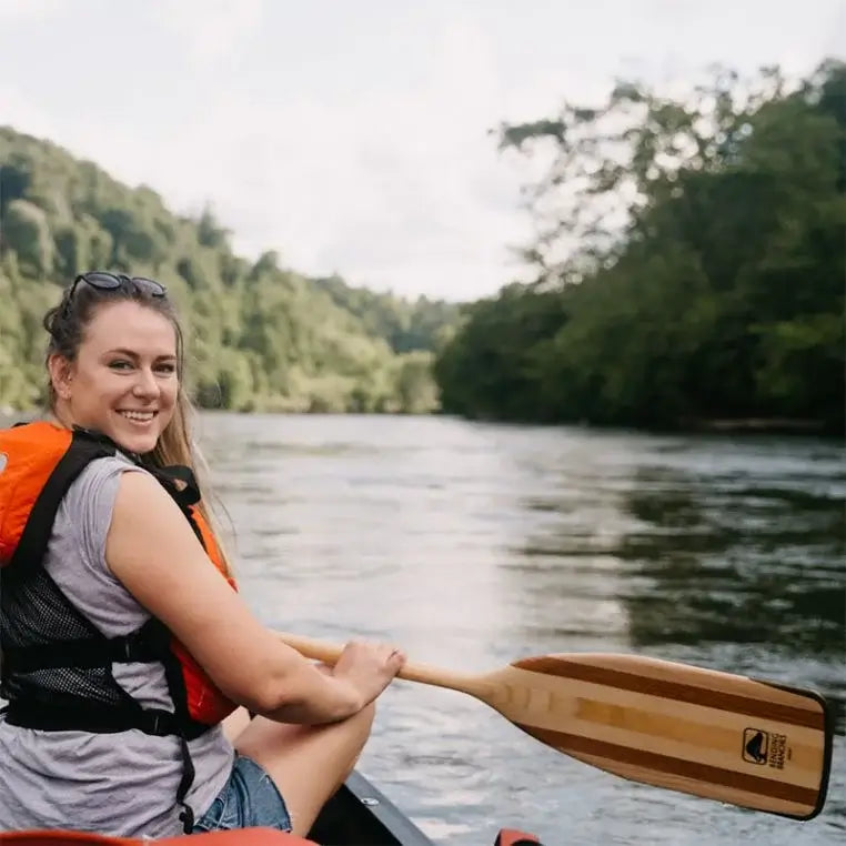 Bending Branches Arrow Paddle being used by a woman on a river