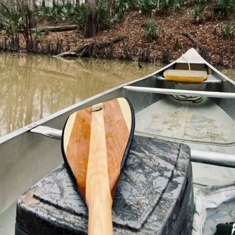 Bending Branches Explorer Plus Paddle in a canoe on a river