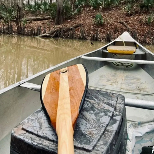 Bending Branches Explorer Plus Paddle in a canoe on a river