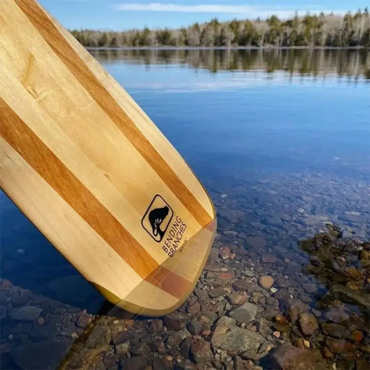 Bending Branches BB Special Paddle Grip As Seen From The Side On A White Background Dipped In The Water Of A Lake