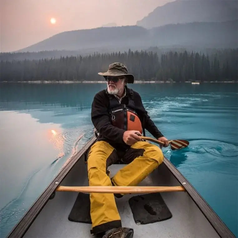 Bending Branches Viper Double-Bend Paddle Being Used By A Man In A Canoe On A Lake
